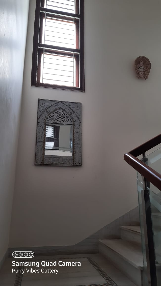 Carved minaret style wall mirror